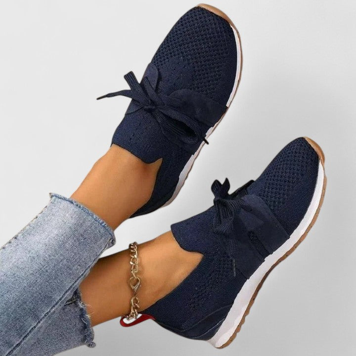Women's orthopedic walking sneakers featuring superior arch support and a convenient slip-on design for active comfort.