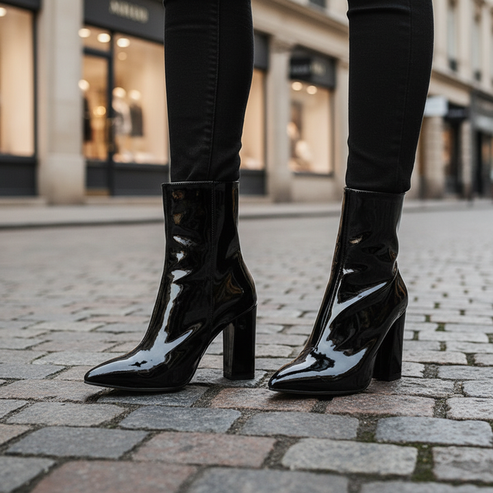 Women's black patent leather ankle boots, elegant with a sturdy block heel and side zip closure, ideal for autumn winter fashion.