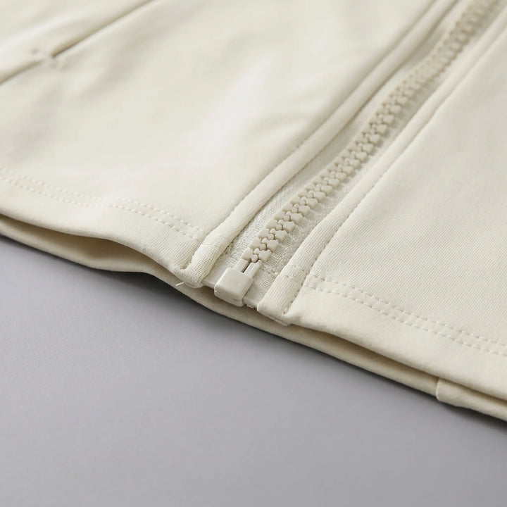 Stylish women's long sleeve running jacket for performance wear, featuring practical thumbholes.