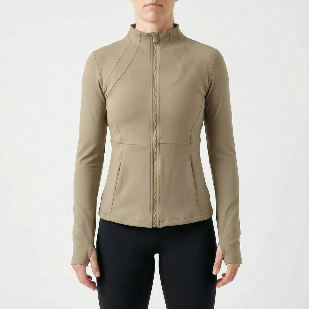 Close-up of women's athletic jacket with thumbholes, showing fabric detail and zip closure.