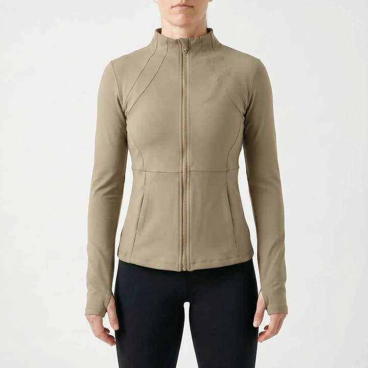 Close-up of women's athletic jacket with thumbholes, showing fabric detail and zip closure.