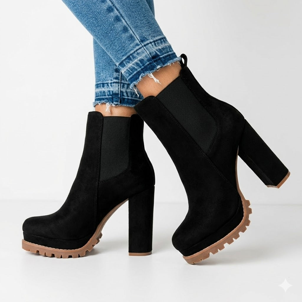 Women's black platform ankle boots with a chunky block heel & slip-on design for versatile everyday wear.