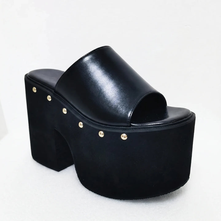 Chunky black platform sandals for women, featuring a bold block heel & open toe design. Perfect for summer.