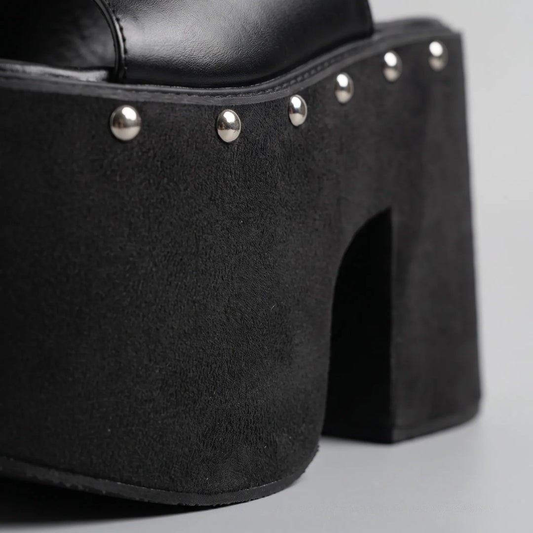 Stylish women's black platform sandals with dramatic high block heel & comfortable chunky sole. Slip-on design.