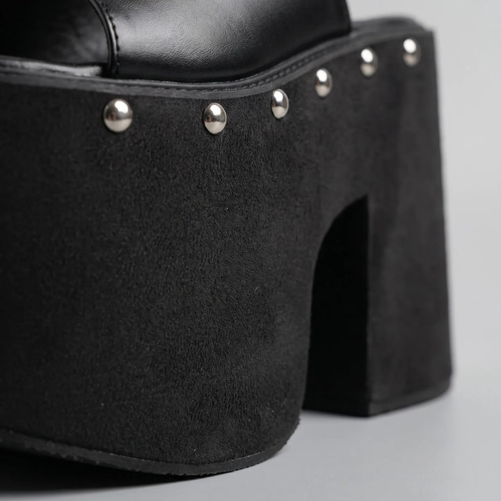 Stylish women's black platform sandals with dramatic high block heel & comfortable chunky sole. Slip-on design.