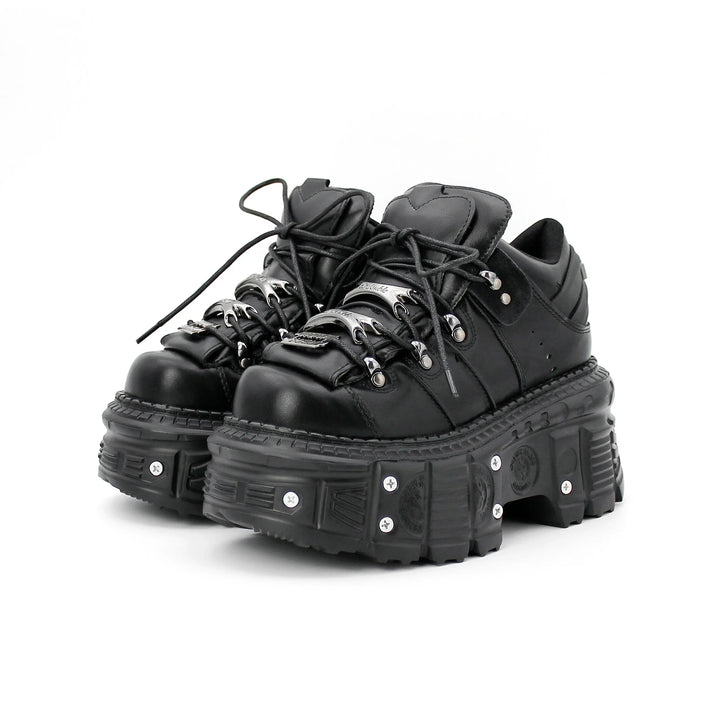 Women's black punk platform shoes with bold nail-studded chunky soles, perfect for alternative fashion.