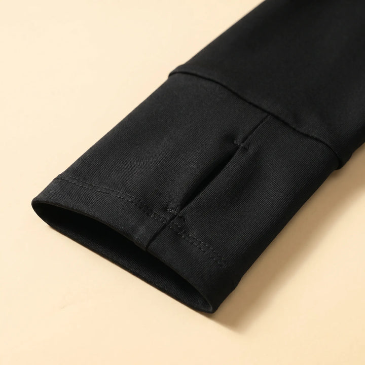 Performance quarter-zip sports top for women, featuring thumb holes for added comfort during cold weather runs.