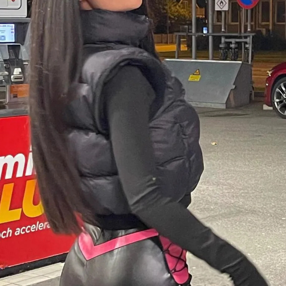 Stylish women's black polyester quilted bodywarmer, offering lightweight warmth and comfort. Casual ladies vest.