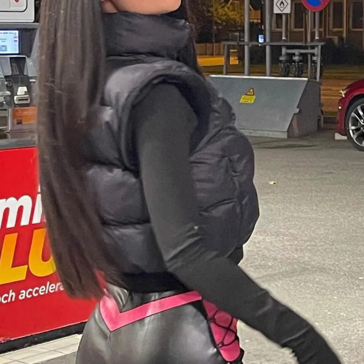 Stylish women's black polyester quilted bodywarmer, offering lightweight warmth and comfort. Casual ladies vest.