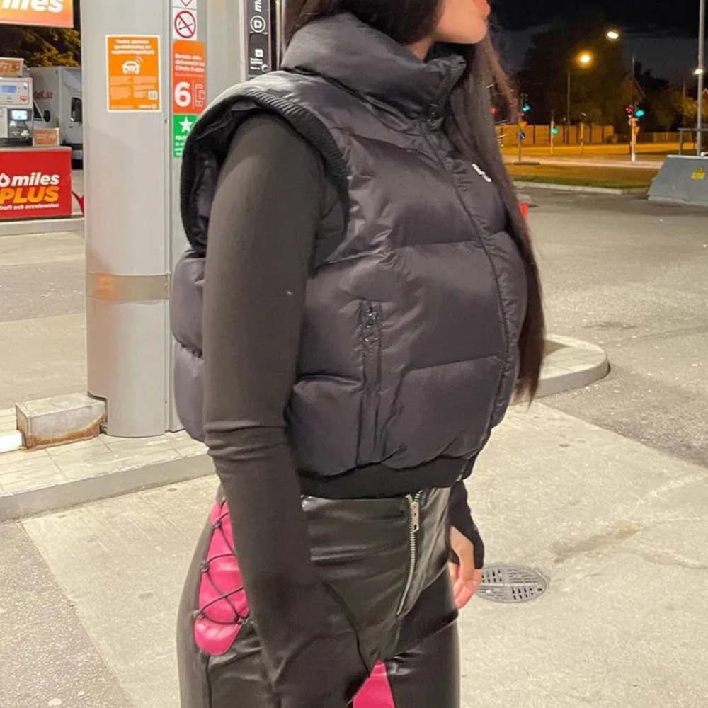 Lightweight women's black quilted bodywarmer providing warmth and comfort. Versatile casual ladies vest.