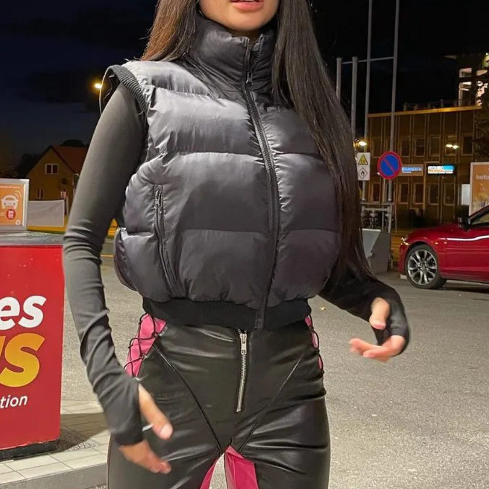 Comfortable black quilted bodywarmer for women, a warm and stylish polyester outerwear vest for casual days.