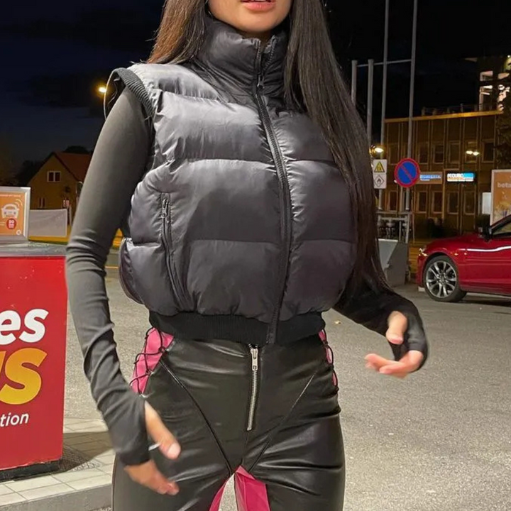 Comfortable black quilted bodywarmer for women, a warm and stylish polyester outerwear vest for casual days.