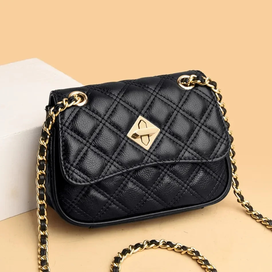 Women's black quilted genuine leather crossbody bag, elegant and compact.