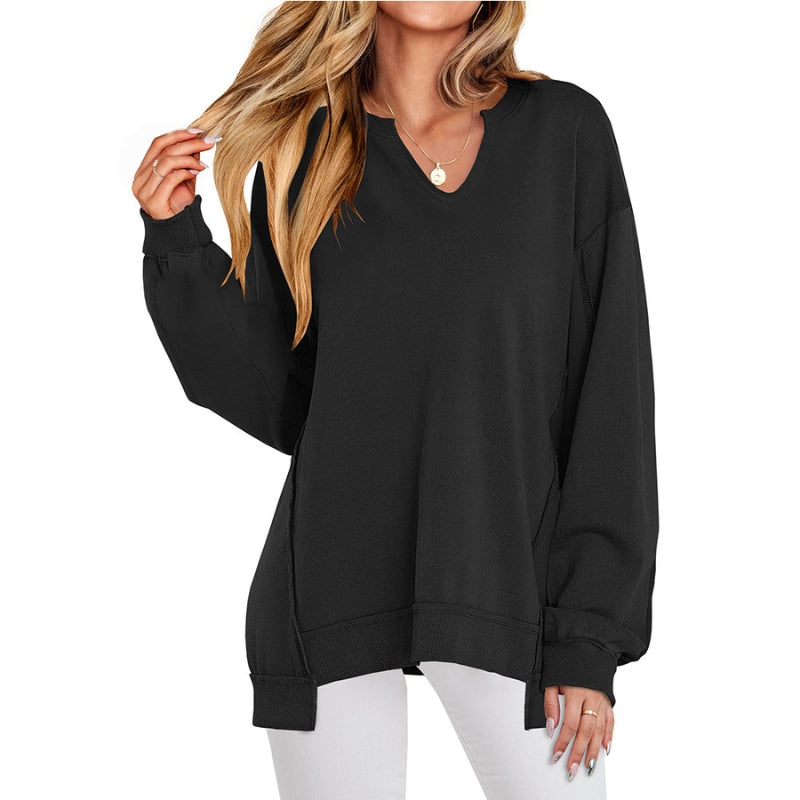 Women's black relaxed fit V-neck tunic sweatshirt. Cozy, long-sleeve top for comfortable everyday wear.