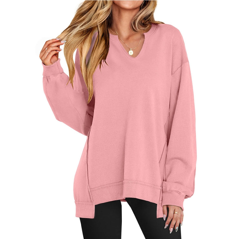 Light gray women's V-neck tunic sweatshirt. Relaxed fit, long-sleeve, comfortable casual top.