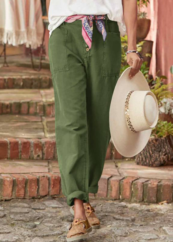 Woman wearing black relaxed wide leg trousers. Adjustable waist, comfortable for active, stylish everyday.