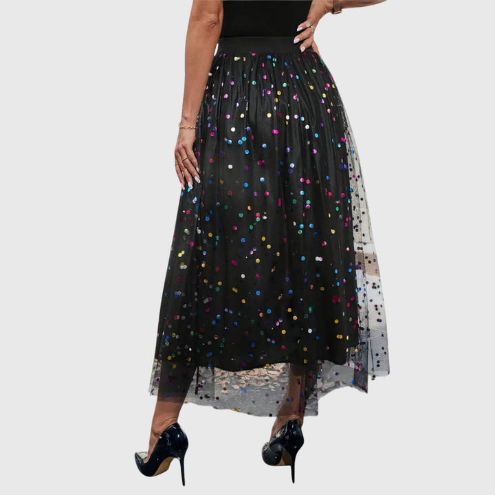 Elegant black sequin & tulle midi skirt for women, designed with a high waist and stylish asymmetric hem.