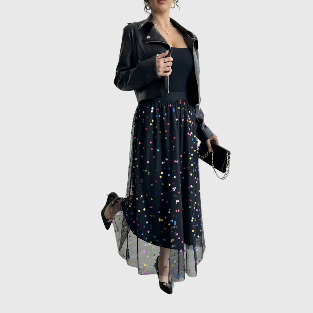 Festive women's black sequin midi skirt, high-waisted with a unique asymmetric tulle hem. Great for special occasions.