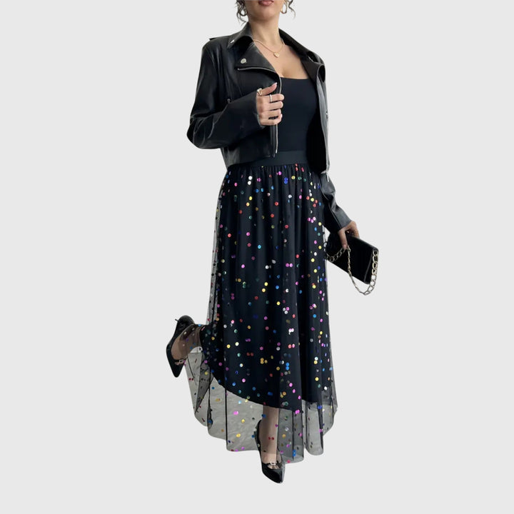Festive women's black sequin midi skirt, high-waisted with a unique asymmetric tulle hem. Great for special occasions.