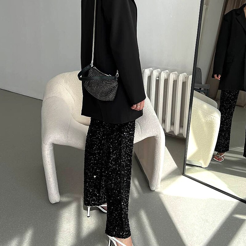 Sparkling silver high-waisted party pants for women, ideal as a comfortable statement piece.