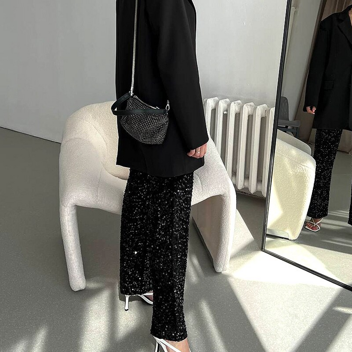 Sparkling silver high-waisted party pants for women, ideal as a comfortable statement piece.