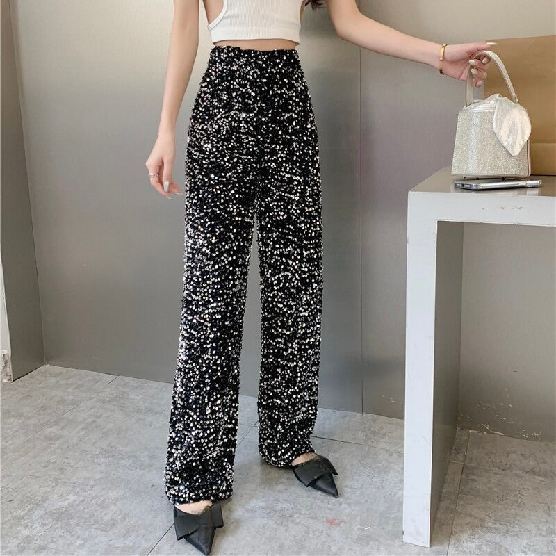 Versatile women's black shimmering high-waisted pants; a stylish fashion statement for night out.