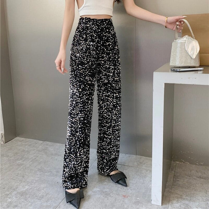 Versatile women's black shimmering high-waisted pants; a stylish fashion statement for night out.