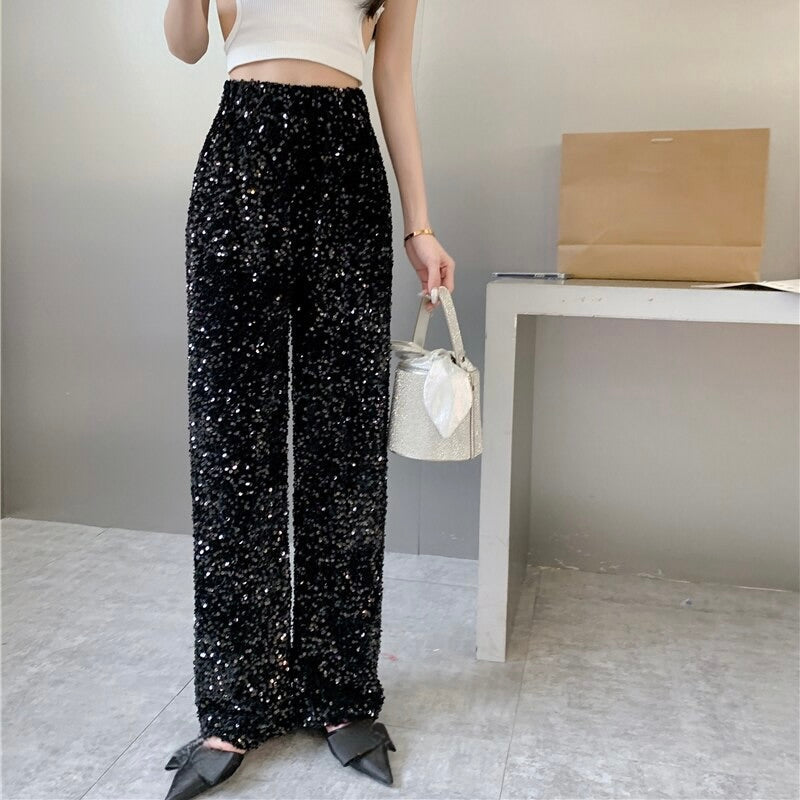 Glamorous silver sparkling high-waisted party pants for women, perfect for a chic night out.