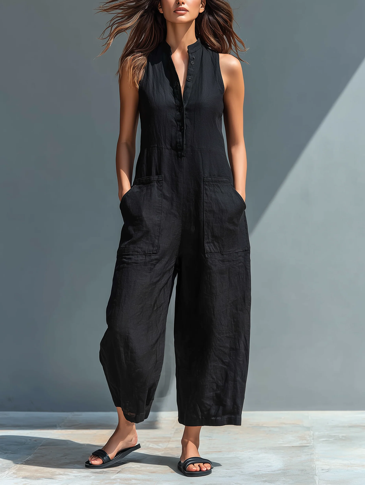 Women's black sleeveless button-up loose-fit jumpsuit, perfect for casual summer wear or travel.