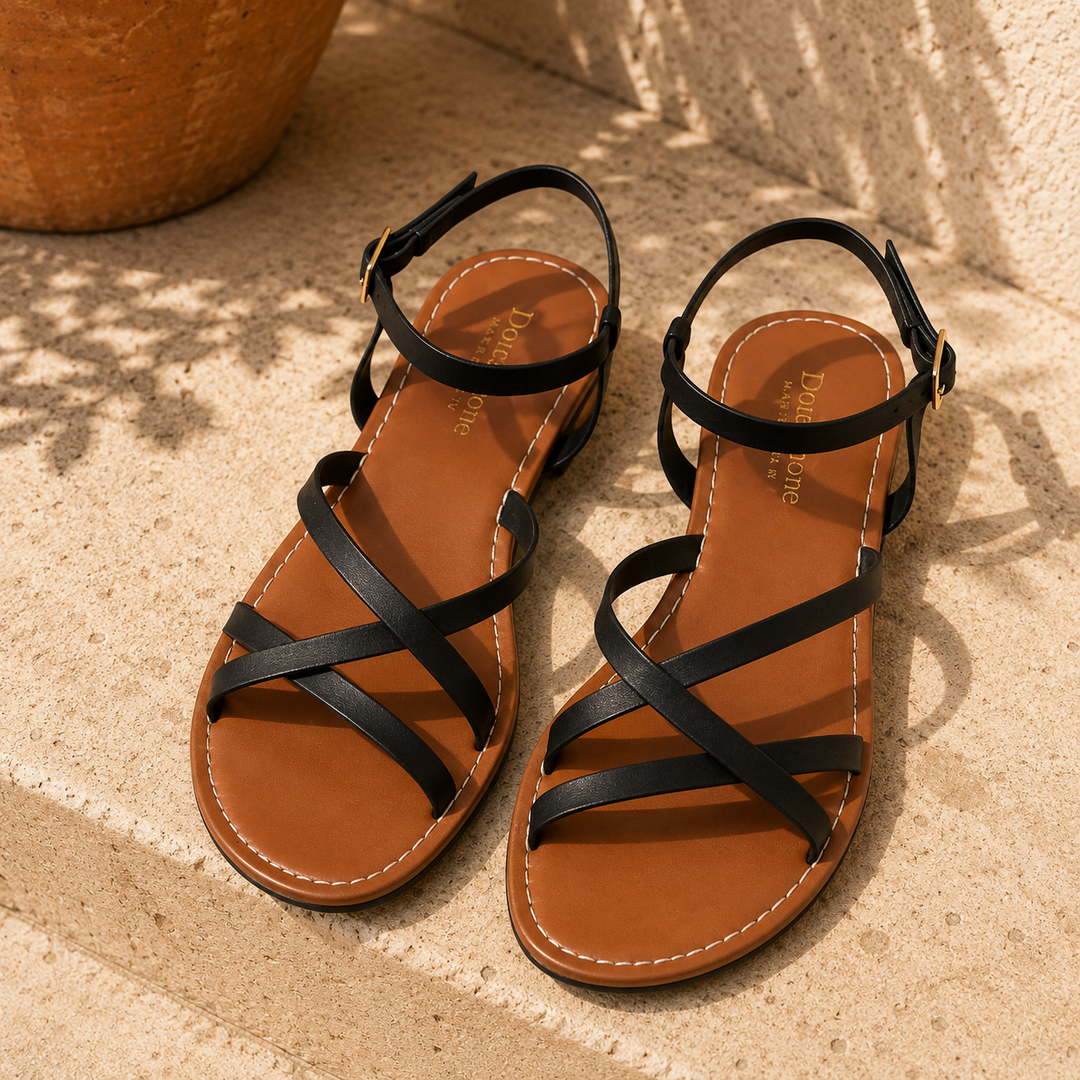 Stylish women's strappy flat sandals with supportive ankle strap and buckle for a secure, chic fit.