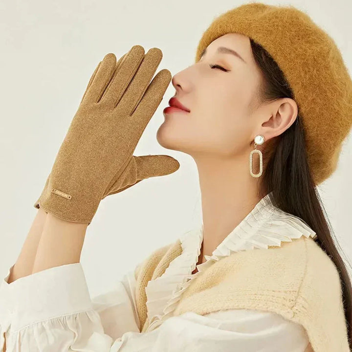 Sophisticated women's black suede gloves with cashmere lining, elegant winter touchscreen accessory