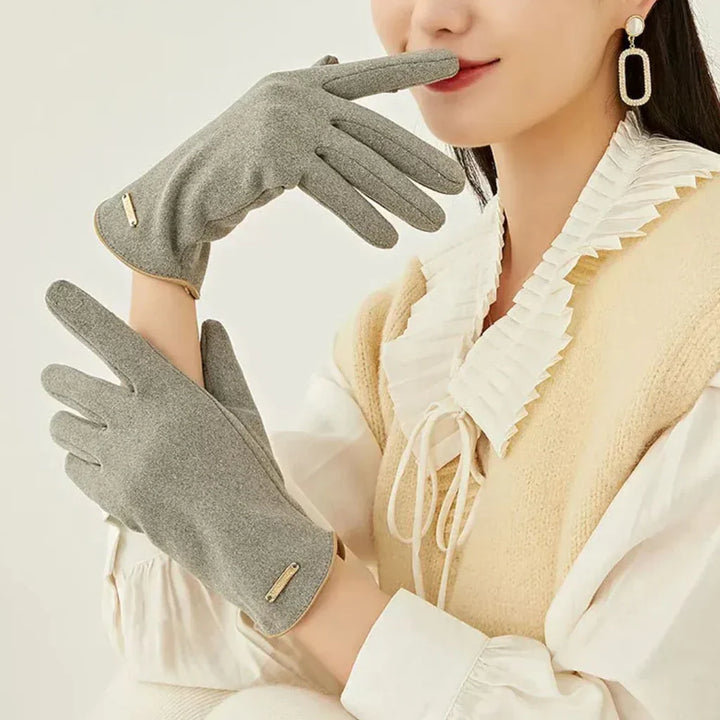 Cashmere-lined women's taupe suede gloves for warmth and convenient touchscreen interaction