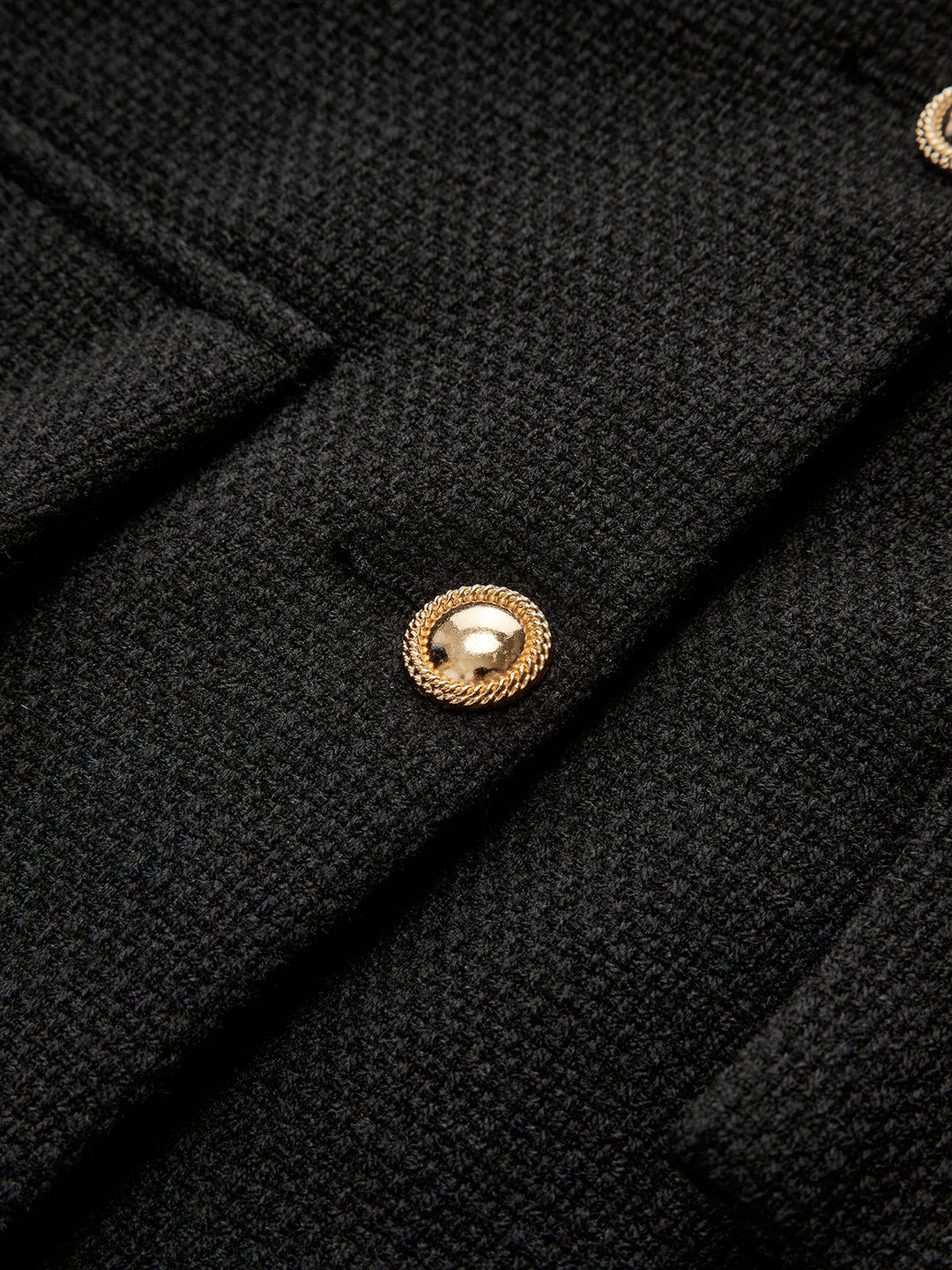 Elegant women's black blazer, featuring stylish gold buttons. Ideal for professional wear, business attire, or formal occasions.