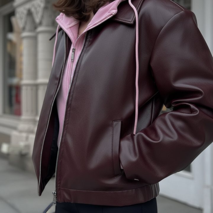 Close-up of the women's vegan leather moto jacket 'Elena', showing texture and zipper detail, autumn style