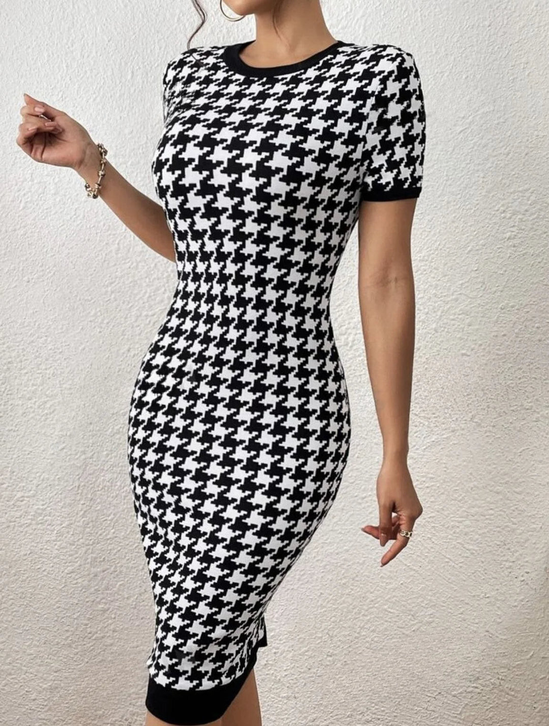 Short sleeve women's houndstooth midi dress in black & white, designed with a sculpted, flattering bodycon silhouette.