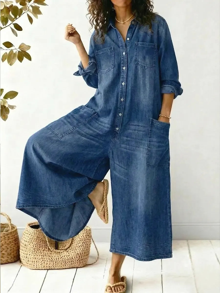 Women's black wide leg button-up jumpsuit. Features long sleeves & relaxed fit for casual wear or travel fashion.