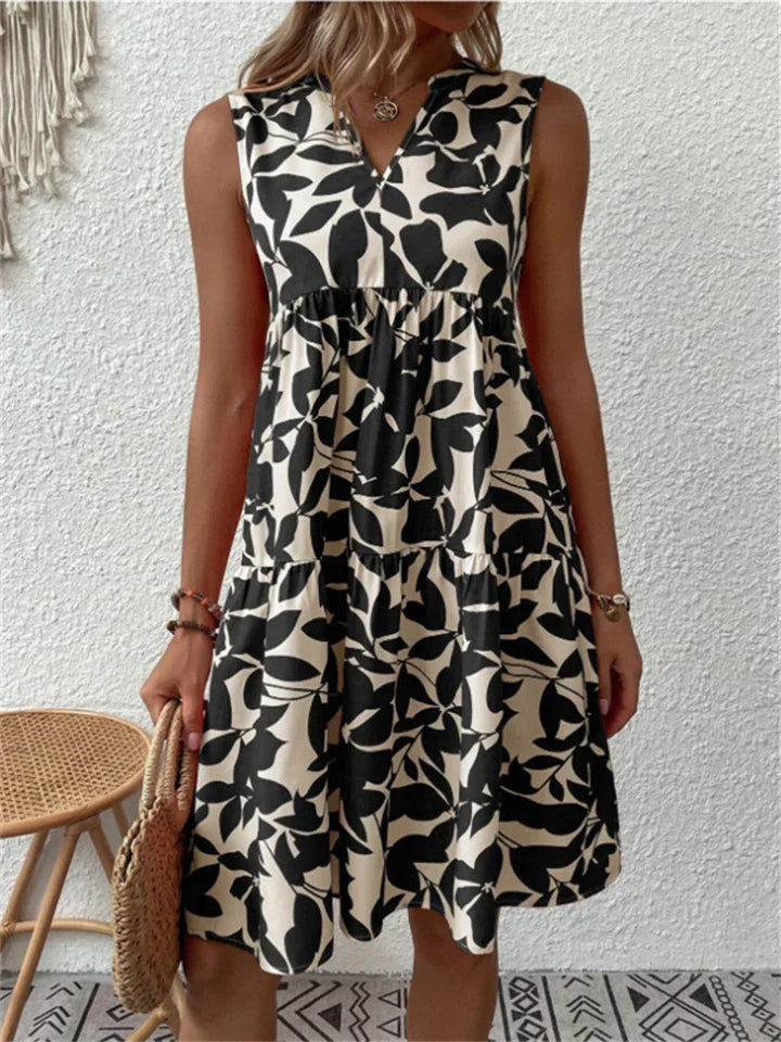 Blooming floral print women's flowy summer dress. A-line silhouette, v-neck, comfortable for spring & vacation.