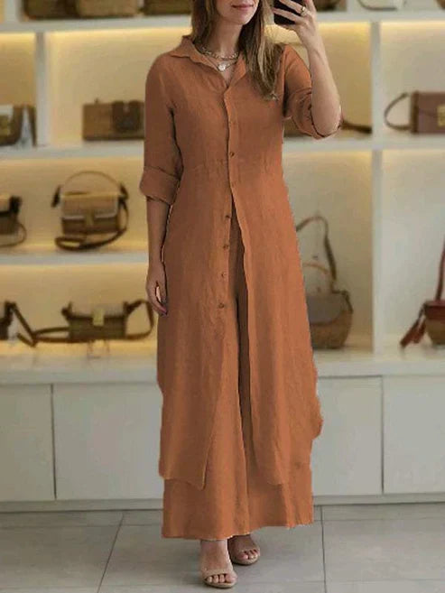 Blue button-down resort wear maxi dress for women, featuring practical 3/4 sleeves and a long, relaxed fit.