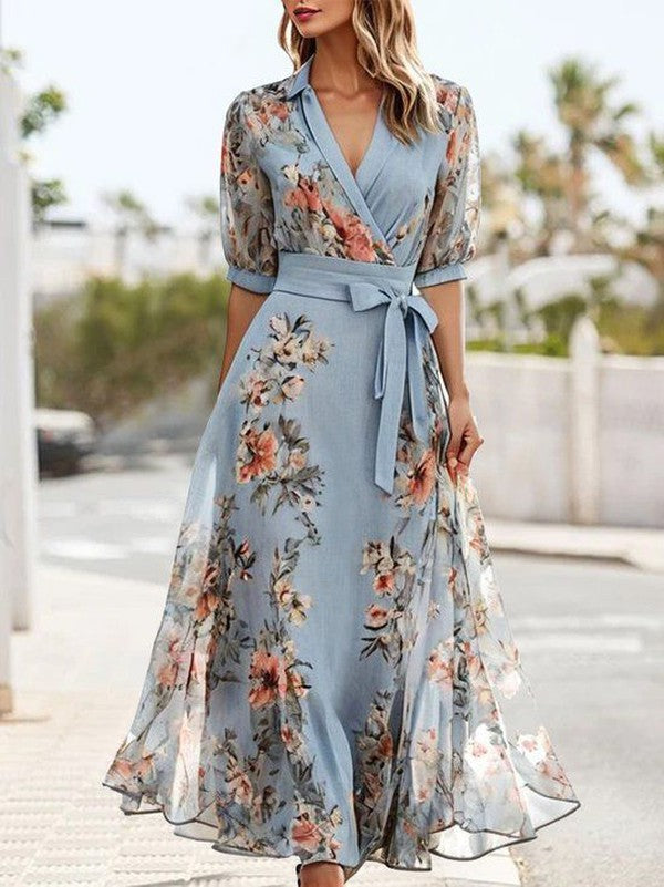 Women's blue floral wrap maxi dress with V-neck, puff sleeves, and tie waist, ideal for summer or wedding guest.