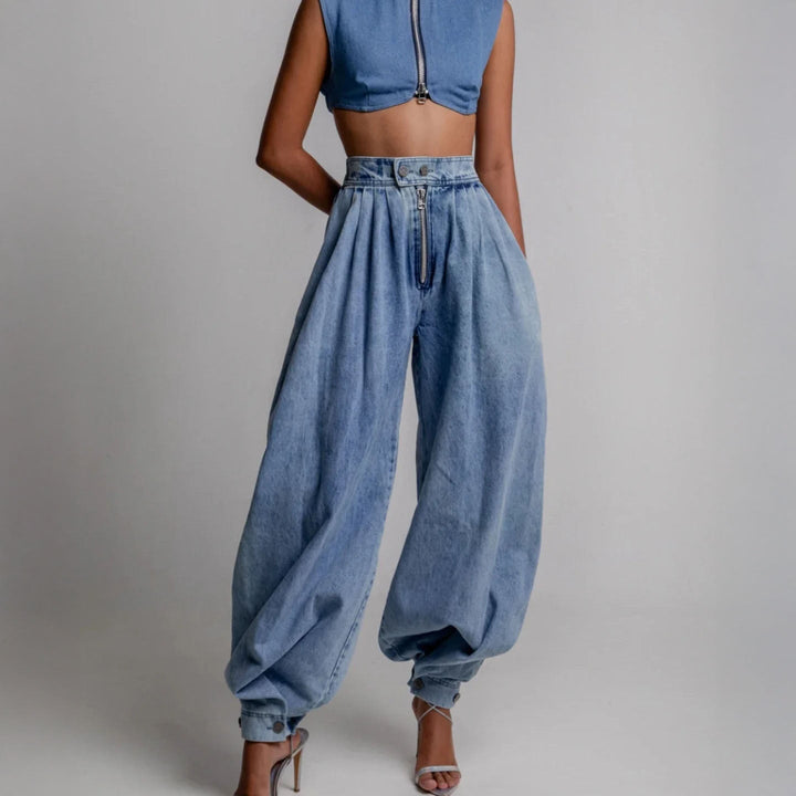 Fashionable women's high-waist blue balloon-leg trousers. Relaxed fit pants, a stylish statement piece for any look.