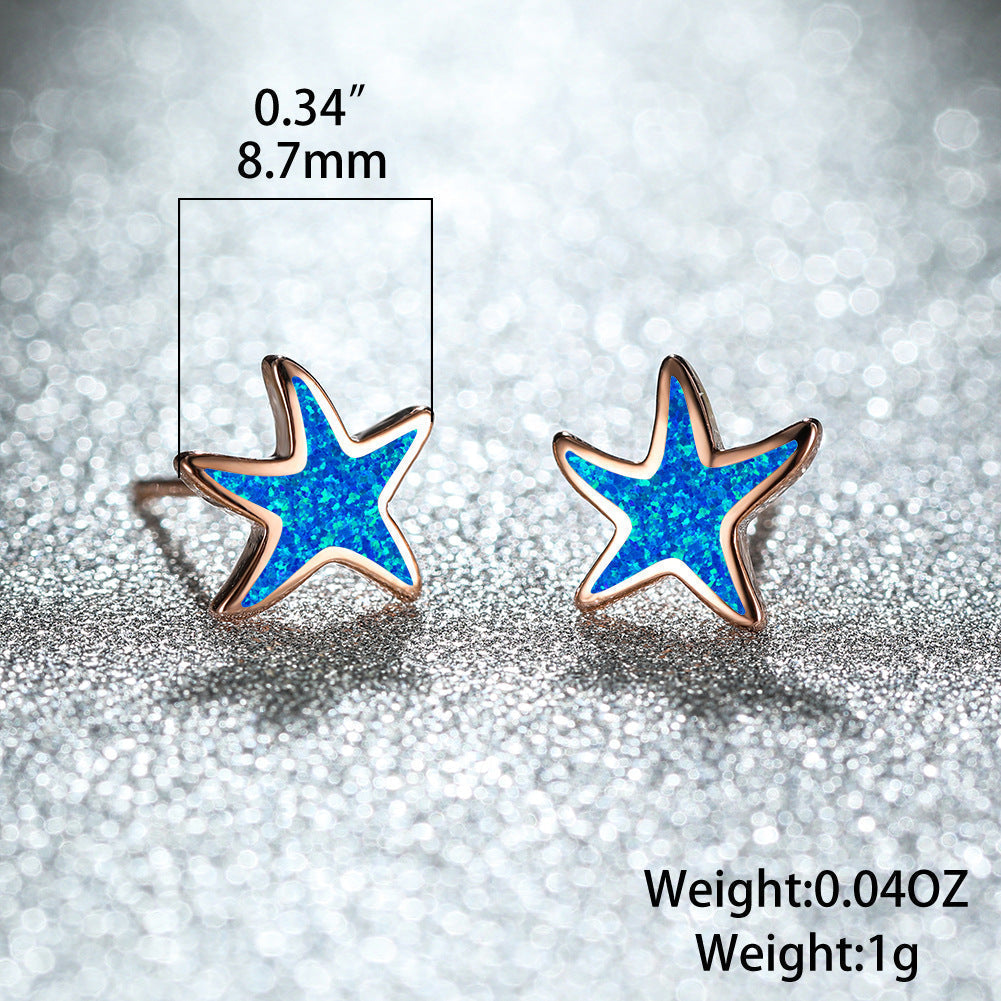 Shimmering blue opal starfish earrings for women, elegant and beach-ready jewelry.