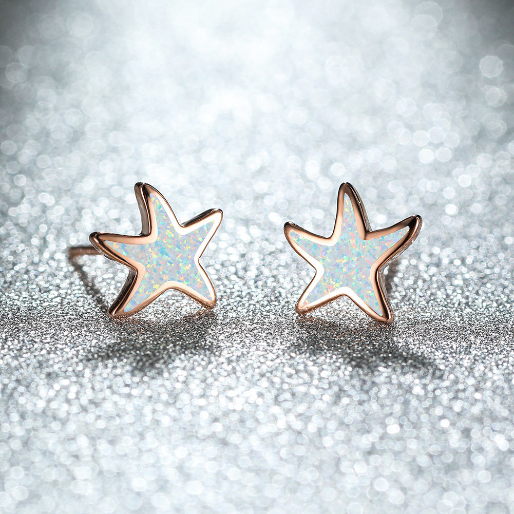 Sparkling blue opal starfish earrings, women's rose gold jewelry, delicate design.