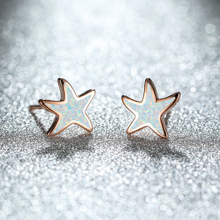 Sparkling blue opal starfish earrings, women's rose gold jewelry, delicate design.