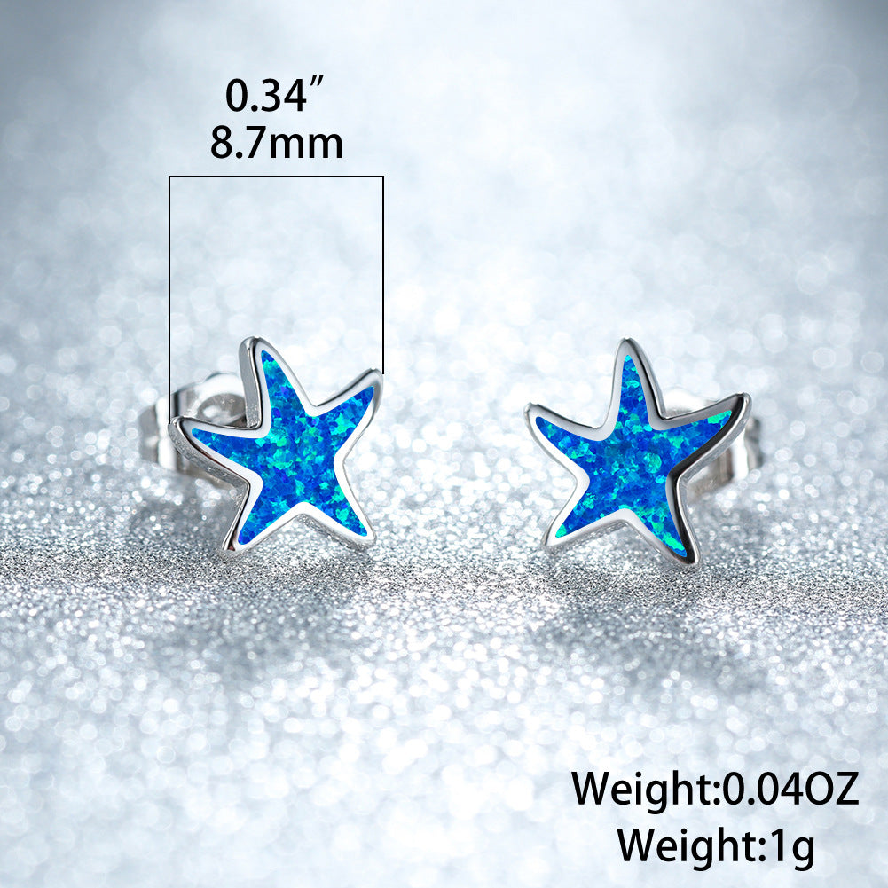 Elegant women's earrings featuring blue opal starfish design, silver finish.