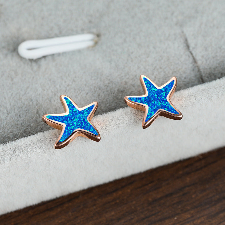 Blue opal starfish earrings with a delicate design, perfect for ocean theme style.