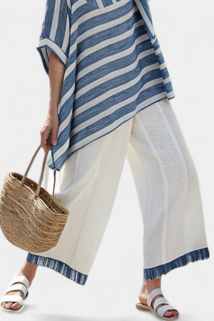 Comfortable two-piece women's striped summer set with a loose batwing top and flowy wide leg pants.