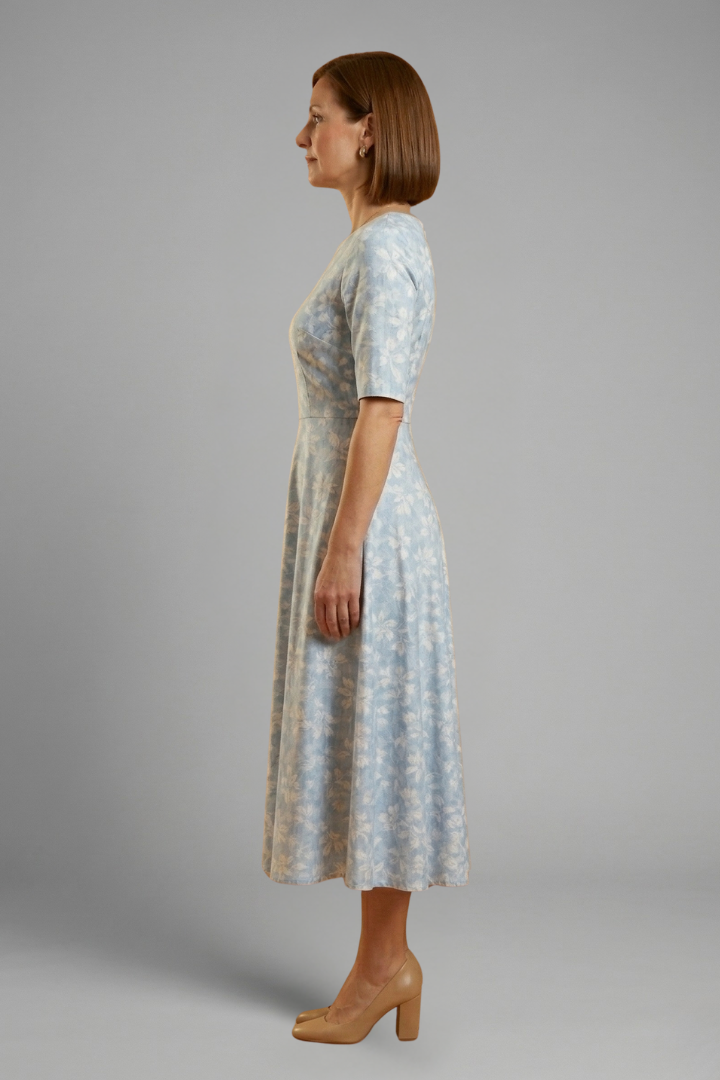 Casual women's blue midi dress with a V-neck, short sleeves, & pockets, ideal for comfortable everyday style.