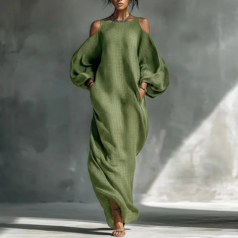 Bohemian women's long sleeve cold shoulder maxi dress. Flowing, relaxed fit for a comfortable and stylish look.