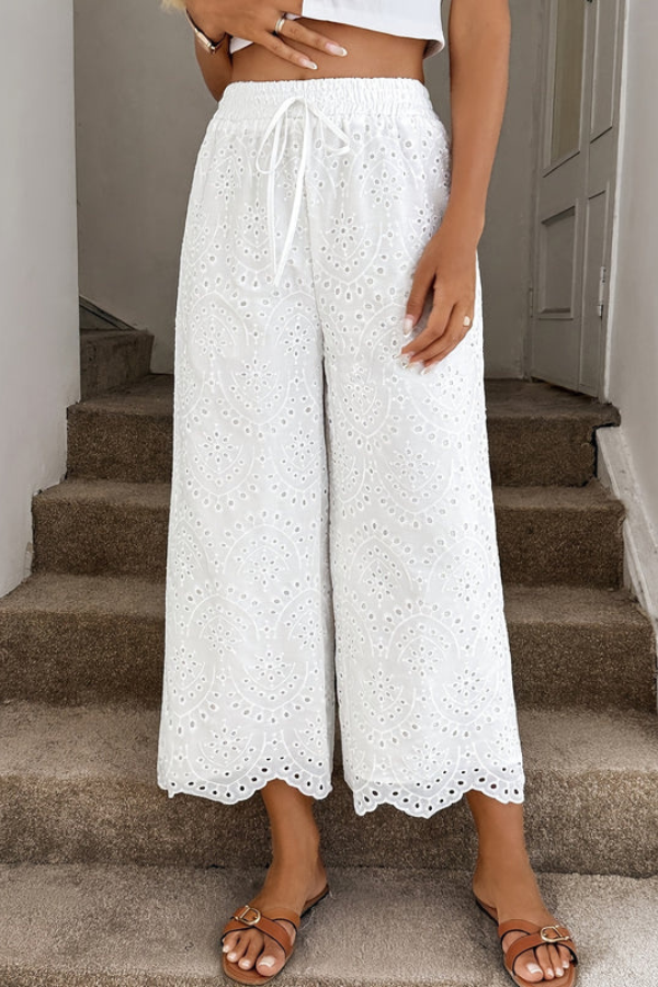 Women's Bohemian cropped summer pants with eyelet details, perfect for warm weather and vacation wear.