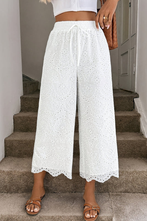 White eyelet women's bohemian cropped pants, great for stylish warm weather outfits & vacation.